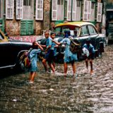 School children in the rain